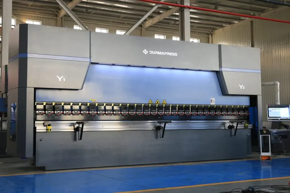 CNC press brake forming sheet metal in a manufacturing workshop