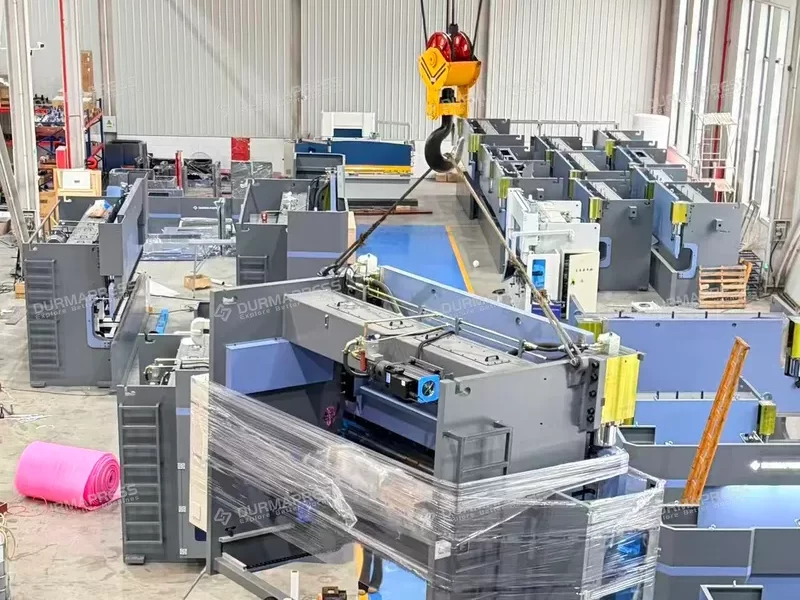Durmapress logistics manager overseeing secure packing and shipment of hydraulic press brakes