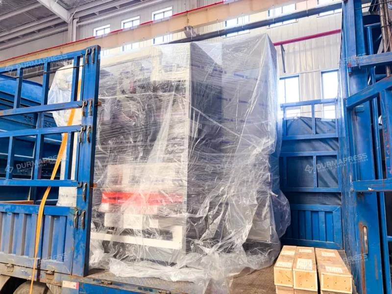 Heavy press brake secured with steel cables for long-distance transport