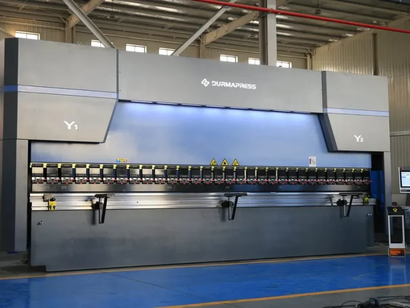 CNC press brake forming sheet metal in a manufacturing workshop